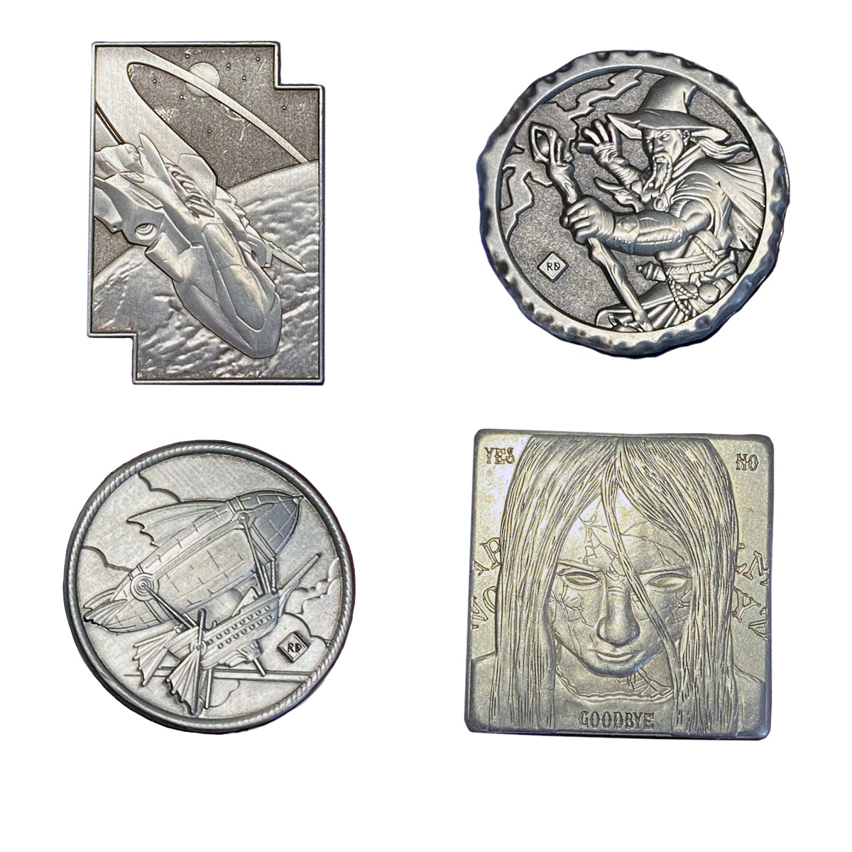 The reverse side of four sci fi and fantasy themed custom challenge coins, in silver color, including a spaceship, a wizard, a steampunk dirigible airship, and a spooky little girl with a ouija-board -themed design